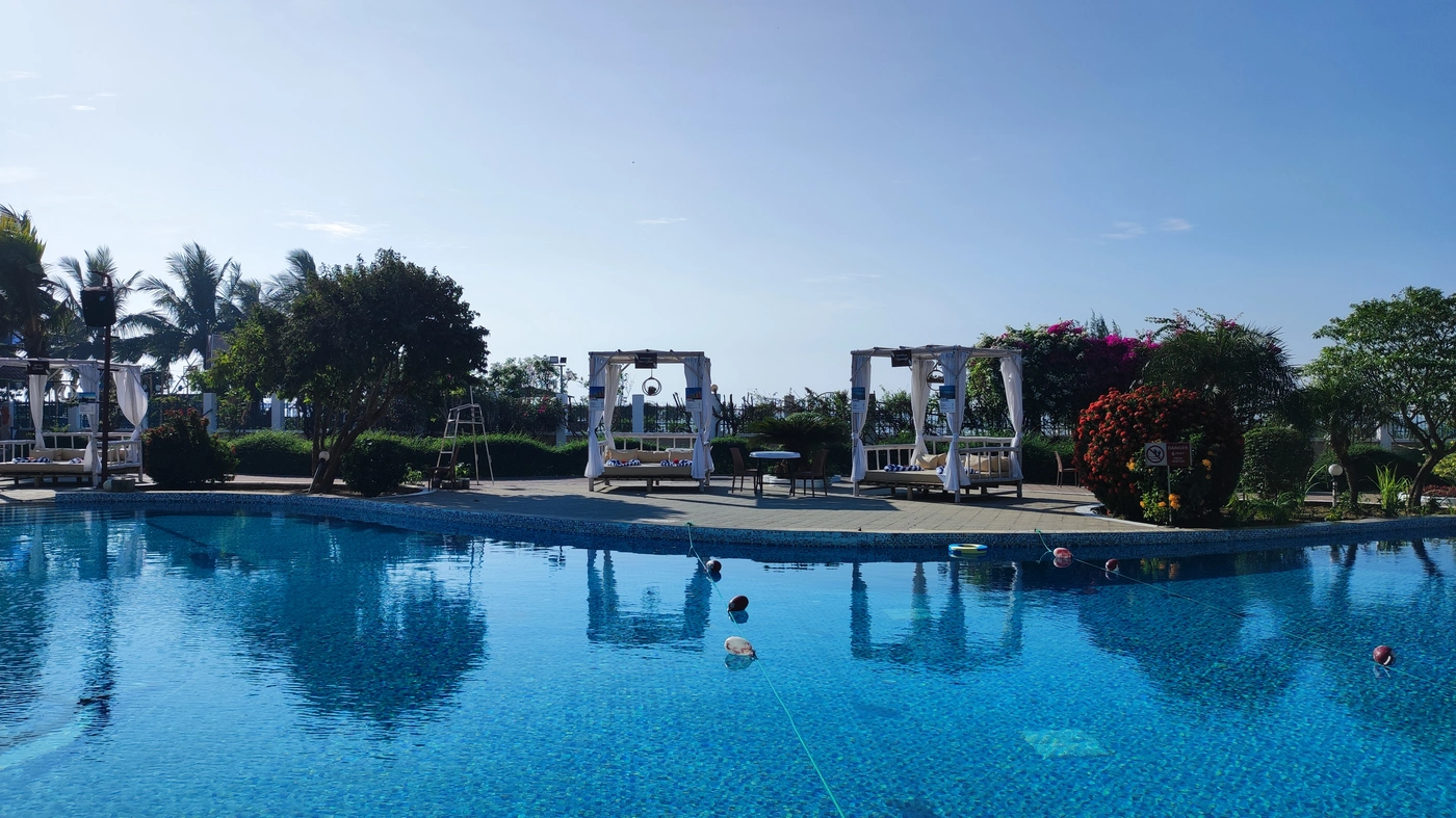 Guests enjoying the tropical resort pool