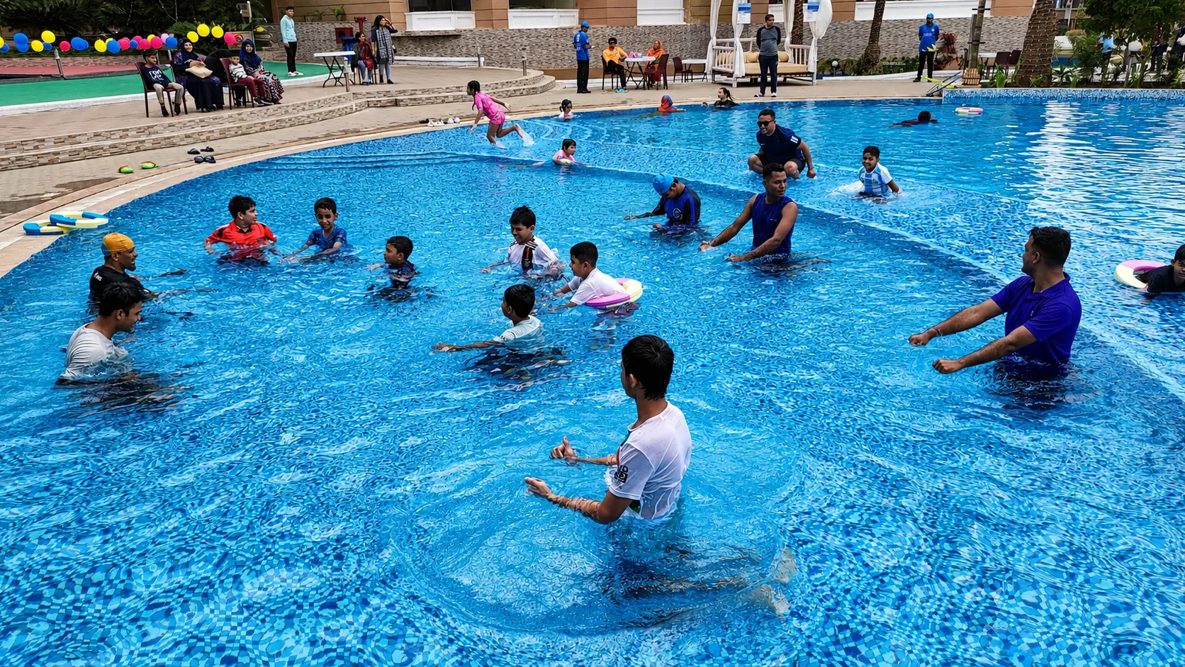 Guests enjoying games in the resort pool
