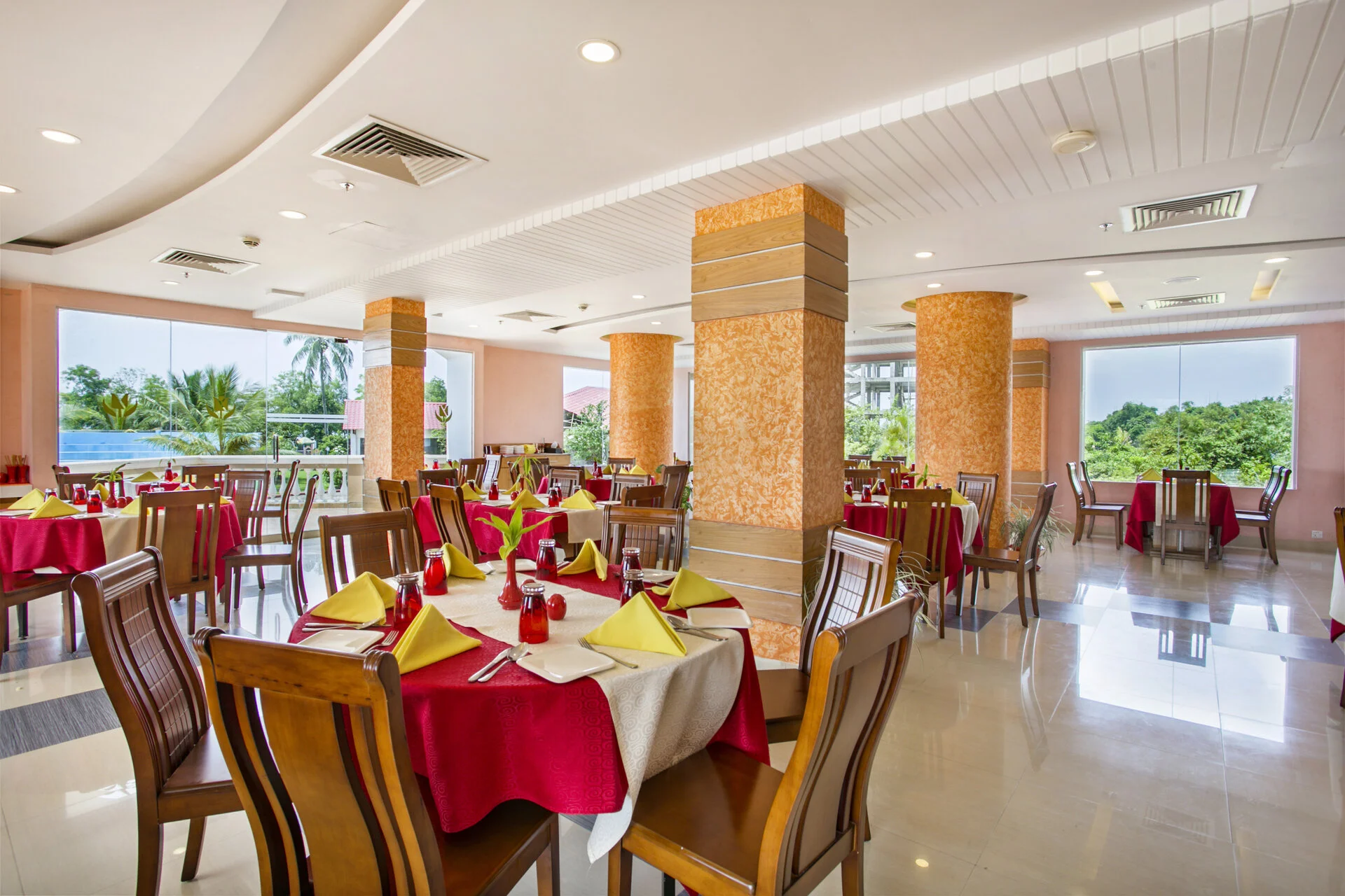 Poolside dining hall with panoramic windows at Sea Pearl